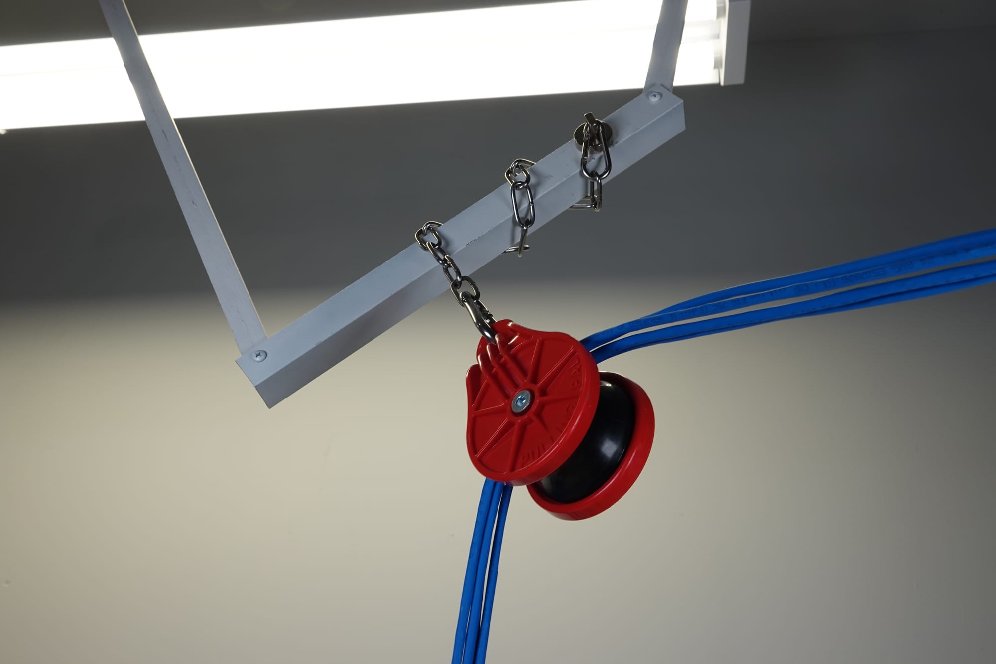 PP10 chained to overhead structure with a cable bundle