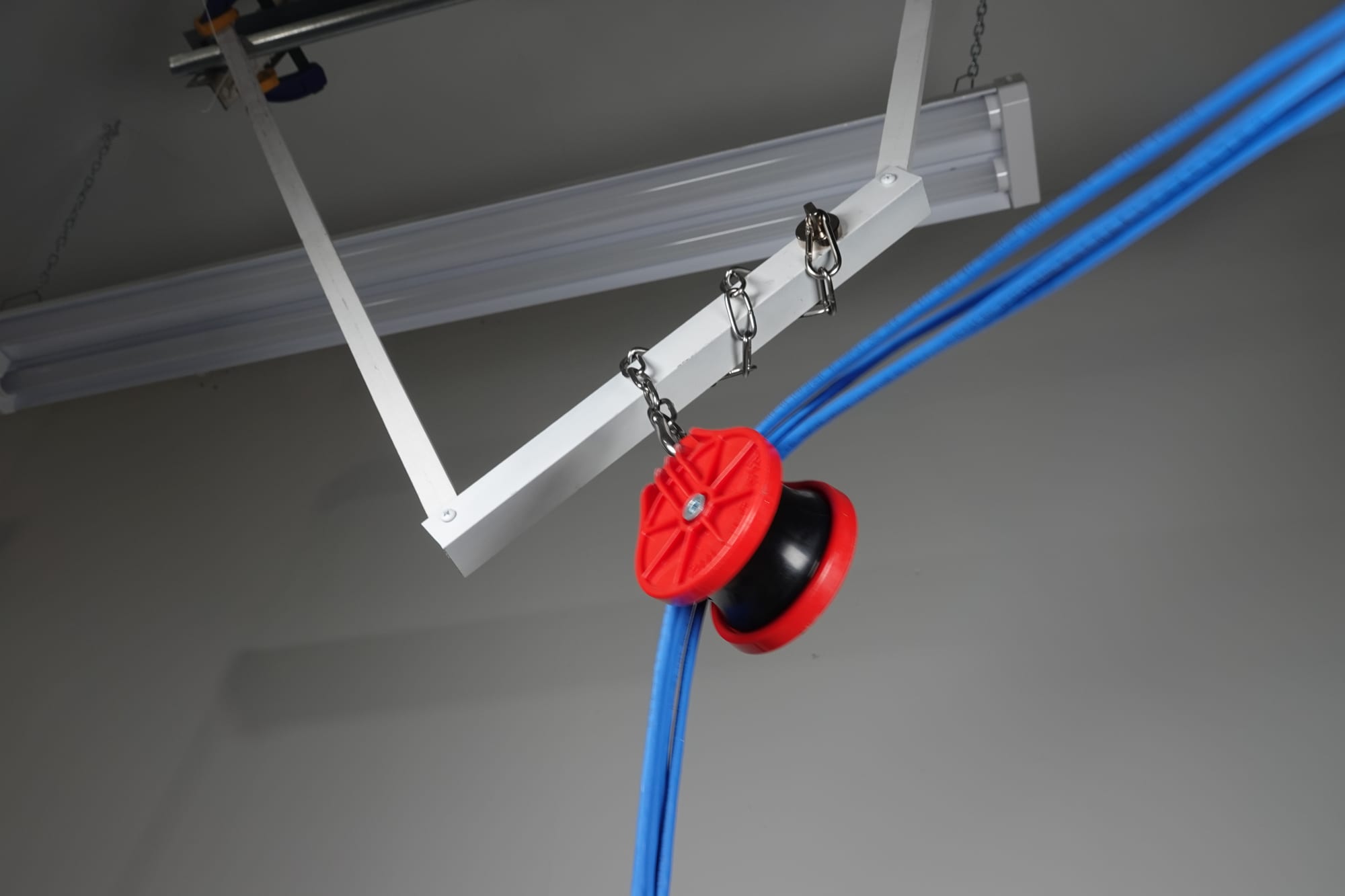 PP10 hung by its chain, guiding a cable bundle through a direction change